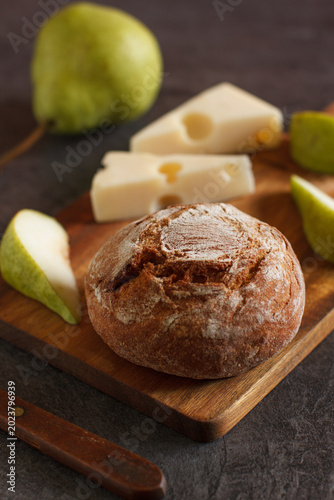 Rustic appetizer with homemade bread, cheese and pears