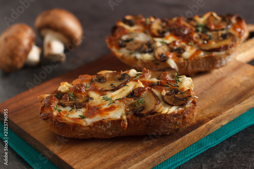Toast with  chanterelle mushrooms and cheese melted on the top