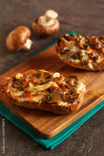 Toast with  chanterelle mushrooms and cheese melted on the top