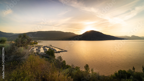 Penticton Okanagan Lake Sunset With Marina And Mountains, Scenic Canadian Landscape Views At Golden Hour