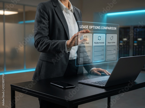 Businesswoman interacting with lease options comparison holographic panel showing short term flexible renewal and buyout details while using laptop computer in contemporary office setting.