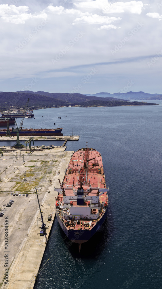 Fototapeta premium Aerial drone photo of famous Skaramangas Shipyards, an emblematic infrastructure in gulf of Elefsina, West Attica, Greece