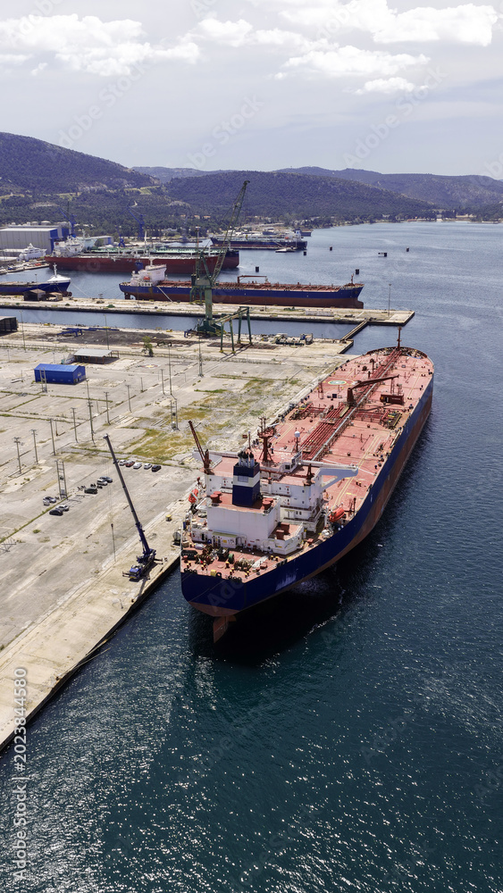 Fototapeta premium Aerial drone photo of famous Skaramangas Shipyards, an emblematic infrastructure in gulf of Elefsina, West Attica, Greece