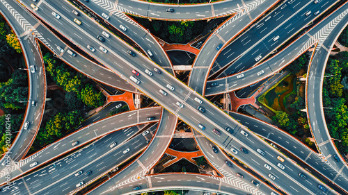 Картината върху платно Aerial top view of complex highway interchange with traffic in modern Chinese ci