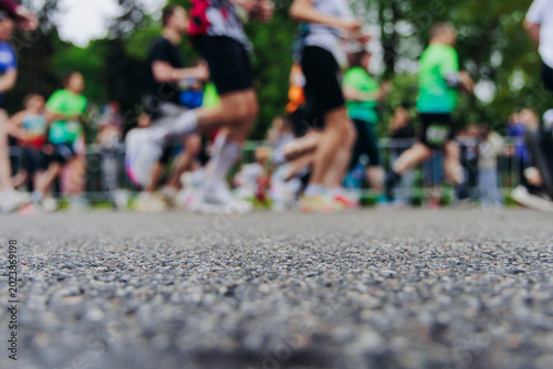 Photography Marathon runners crowd, sportsmen participants start running the half-marathon i