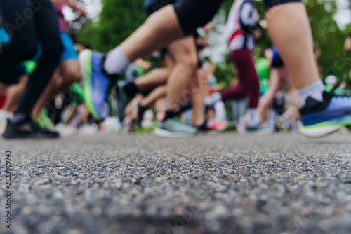 Photography Marathon runners crowd, sportsmen participants start running the half-marathon i