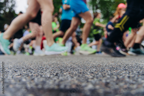 Fotografía Marathon runners crowd, sportsmen participants start running the half-marathon i