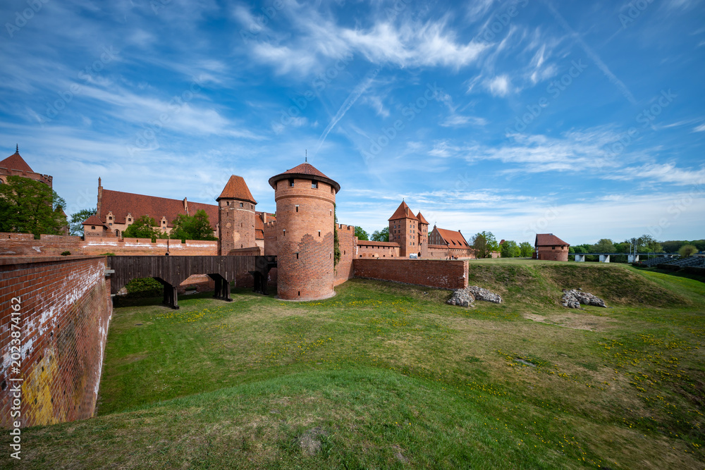 Fototapeta premium Malbork Castle, on the banks of the Nogat River. Malbork, Poland