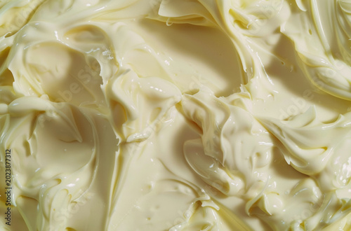 Photo of Cream colored garlic mayonnaise sauce. Food photo for backdrops or recipes