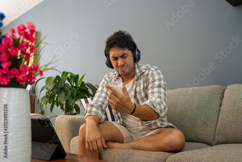 Konstfotografi Man feeling disgust drinking sour milk in living room