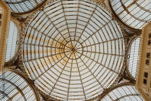 Interior of Galleria Umberto I with glass barrel vault ceiling in Naples, Italy