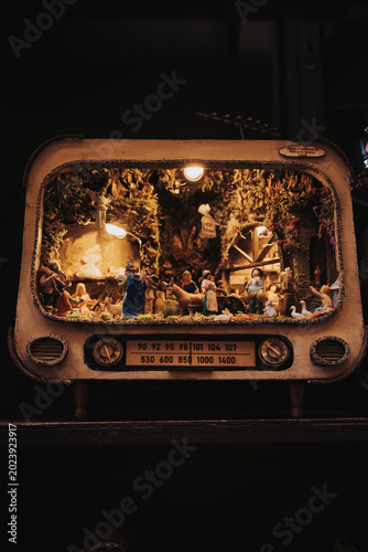 Traditional Neapolitan nativity scene built inside a vintage retro television casing in Naples Italy