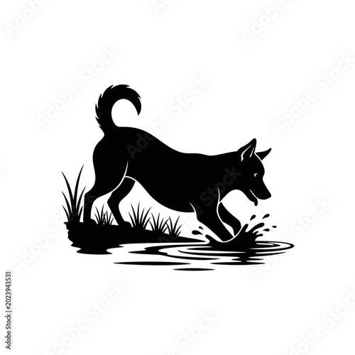 Bild auf Leinwand Dog fetching stick in water with person silhouette