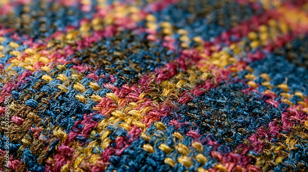 Obraz premium Colorful Woven Textile Fabric Art: Pattern, Texture, and Craftsmanship