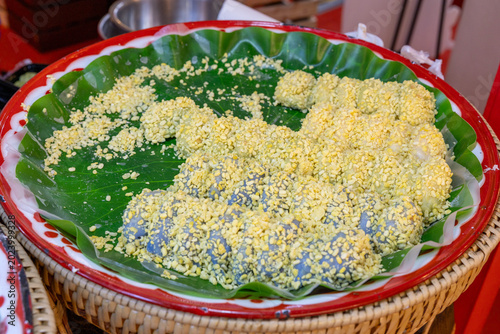 Soft mung bean crepe or Kanom Thuapaep. Mung bean rice crepe or Mung bean dumpling. Yellow bean rice crepe. Thai delicious dessert with peanut and soft flour with soybean sprinkle all over the dough