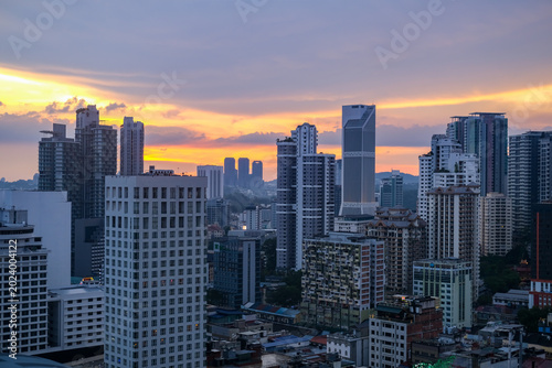 Photography Sunset cityscape of Bukit Bintang in Kuala Lumpur, Malaysia, featuring modern skyscrapers and vibrant urban atmosphere in one of the city’s most popular tourist destinations
