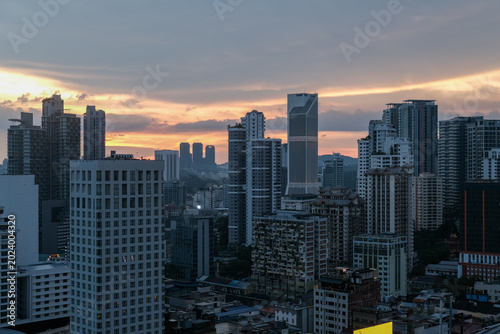 Canvas Print Sunset cityscape of Bukit Bintang in Kuala Lumpur, Malaysia, featuring modern skyscrapers and vibrant urban atmosphere in one of the city’s most popular tourist destinations