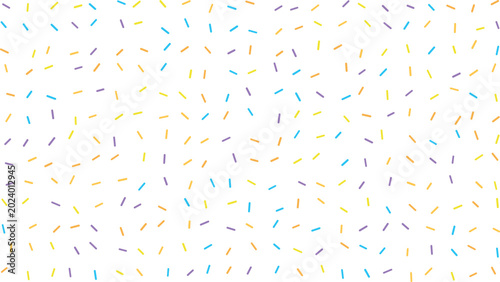 Foto Colorful candy sprinkles are scattered across a clean white surface creating a v