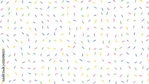Fotografie A charming display of multicolor candy sprinkles randomly dispersed upon a spotl