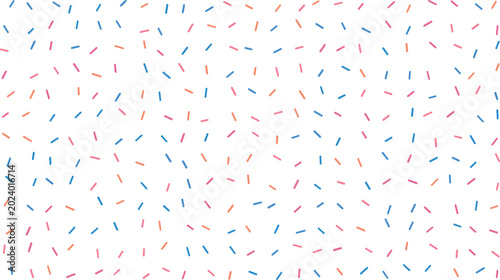 Foto A cheerful random assortment of pink blue and orange sprinkles on a bright white