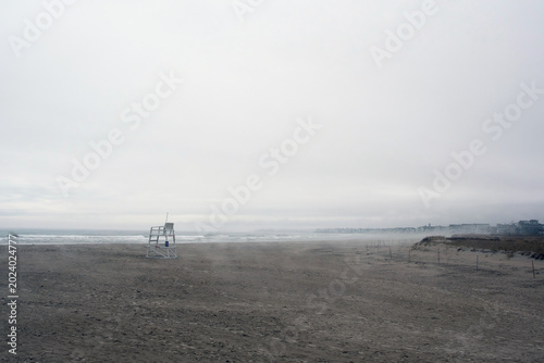 Empty Lifegaurd tower on foggy beach