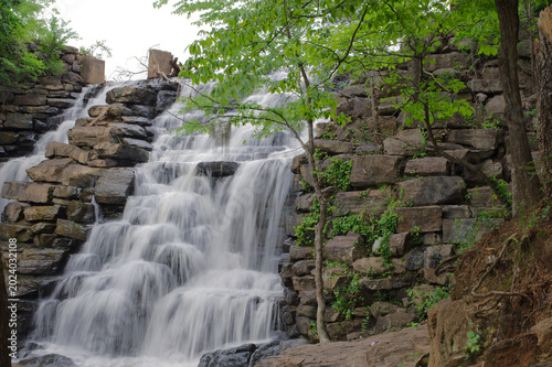 Photos Tranquil Forest Waterfall Cascading Over Layered Rock Steps Surrounded by Greenery in Chewacla State Park Auburn, AL