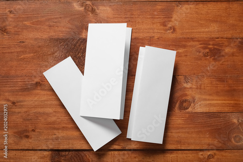 Blank brochures on wooden b...