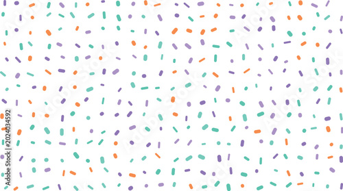 A charming arrangement of colorful sugar sprinkles including orange light blue and purple shades on white