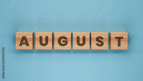 Foto August Wooden Blocks: The word AUGUST spelled out in capital letters on wooden blocks arranged in a line against a teal blue background, symbolizing the month