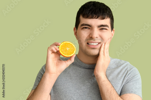 Young man with orange suffe...