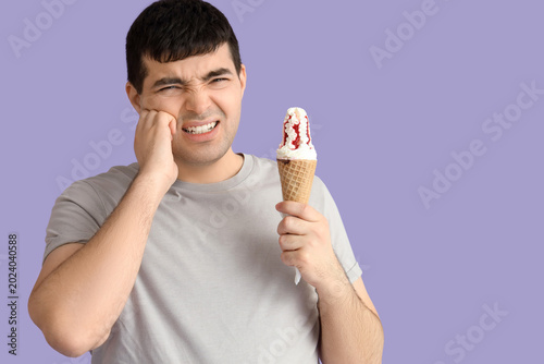Young man with ice cream su...