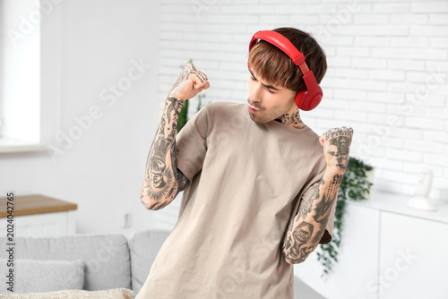 Young tattooed man with hea...