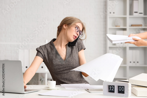 Young businesswoman working...