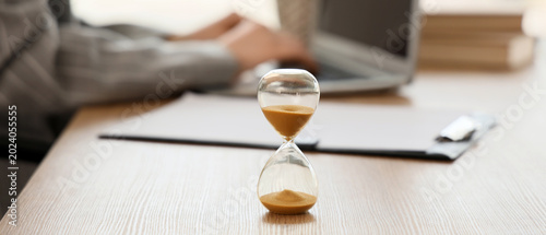 Hourglass against businessw...
