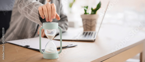 Businesswoman with hourglas...