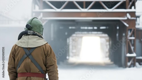 Industrial Sandblaster in Protective Gear Standing in Snowy Factory Yard