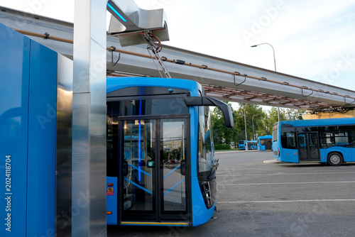 Electric buses are in the parking lot on a charge. Eco-friendly urban public transport
