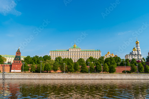 Moscow, Russia - May 16, 2025: View of the Moscow Kremlin from the Kremlin Embankment of the Moskva River. The Grand Kremlin Palace. Spring sunny morning