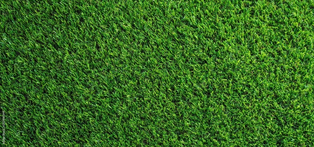Obraz premium Artificial grass creating vivid green texture background