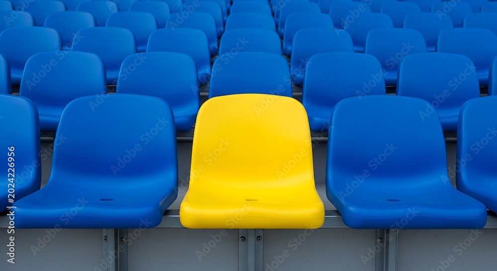 Fototapeta premium Single yellow stadium seat among blue.
