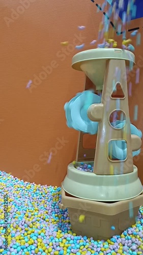 Sensory toy, shape sorter funnel at childrens museum, perfect for educational resources, preschool activities, toy store advertisements, and parenting blogs.