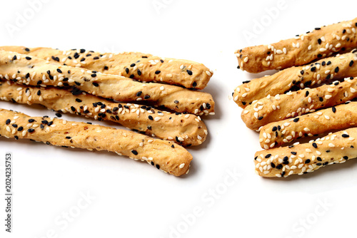 Bild auf Leinwand Crispy breadsticks with black and white sesame seeds