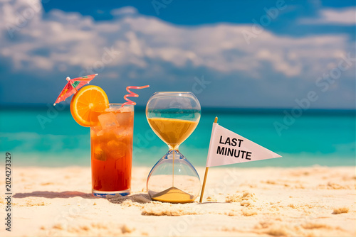 Last minute cocktail on a beach with an hourglass