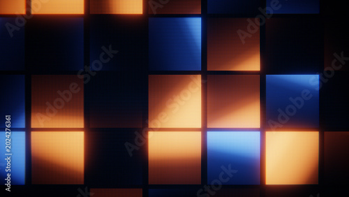 Illuminated square pixels display a digital mosaic in blue and orange colors