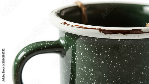 Enamel mug for outdoor entertaining and camping lifestyle photography on white