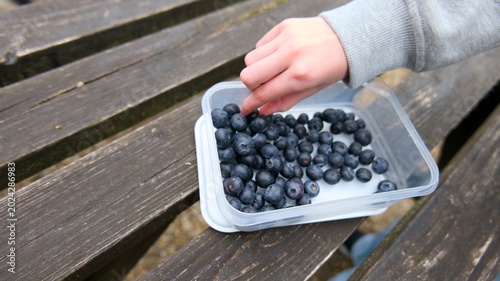 Child Eating a Healthy Fruit Snack Outdoors