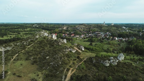 Cliffside trail through green forest landscape