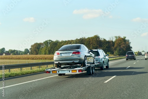 Obraz na płótnie Professional tow truck hauling car safely
