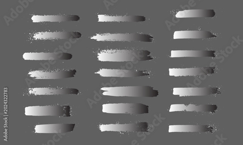 Set of metallic silver gradient grunge brush strokes with paint splatter effect. Abstract vector design elements for banners, text boxes, dividers, and underlines on dark background.