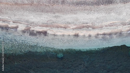 Aerial View. Stone Beach And Clear Sea Water
